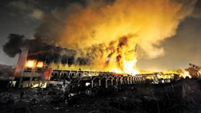 A cloud of smoke billows from the burning Marriott hotel in Islamabad, following the powerful bomb blast on September 20, 2008 that killed 40 people.