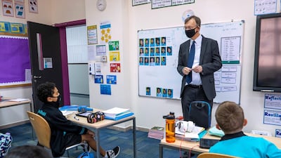 Patrick Horne, headmaster at British International School Abu Dhabi, talks to pupils.
