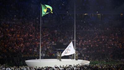 The Olympic flag is raised during the opening ceremony. Issei Kato / Reuters
