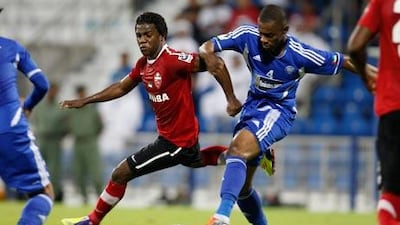 Al Nasr’s Helal Saeed, right, takes the ball from Al Ahli’s Ismael Al Hamadi.