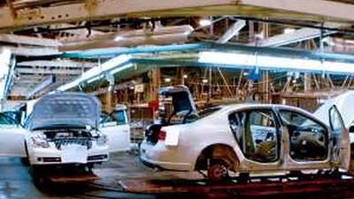 Buick Lucerne cars make their way down an assembly line at the GM plant in Detroit. US-made cars are a popular import.