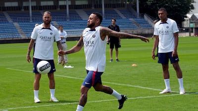 Paris Saint-Germain's Sergio Ramos, Neymar and Kylian Mbappe play with the ball. AP Photo