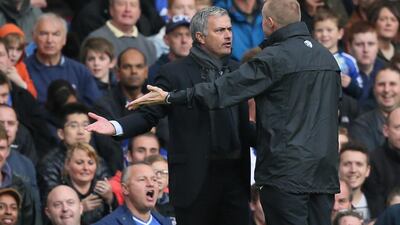 Chelsea's manager Jose Mourinho, left, gestures and looks at the fourth official Trevor Kettle, right, before e was then sent off by referee Anthony Taylor during the Premier League match between Chelsea and Cardiff City. Alastair Grant / AP Photo