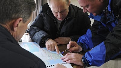 Russian president Vladimir Putin looks at a map of the Crimean Peninsula. Syria is not the first example of Russia playing politics across a country's territory (Photo: EPA/Mikhail Klimentyev/Sputnik/Kremlin Pool)