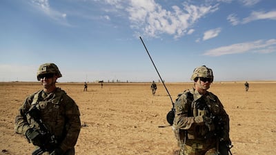 US soldiers on patrol in a rural village near a coalition outpost in western Iraq after pushing ISIL fighters out of the area / AP