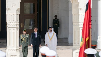 Sheikh Mohamed bin Zayed and Giuseppe Conte stand for the national anthem, during a reception held at the Presidential Palace on November 15, 2018. Rashed Al Mansoori / Ministry of Presidential Affairs