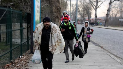 Migrants walk to the border gate of Pazarkule in Edirne, near Turkey-Greece border. An air strike by Syrian government forces killed scores of Turkish soldiers in northeast Syria, a Turkish official said Friday, marking the largest death toll for Turkey in a single day since it first intervened in Syria in 2016. AP