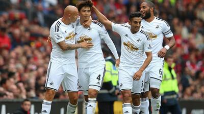 Ki Sung-Yeung of Swansea City celebrates a goal against Manchester United. (Photo by Alex Livesey/Getty Images)