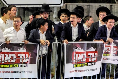 Ultra-Orthodox Jewish men protest against the arrests of men from the community for dodging conscription, near the Bet Lid military prison in central Israel. AFP