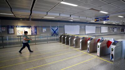 A commuter wearing a protective mask exits a metro station in Bangkok, Thailand. EPA