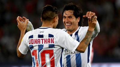 Jonathan Urretaviscaya and Jorge Hernandez of Pachuca celebrate victory over Morocco's Wydad Casablanca in the quarter-finals of the Fifa Club World Cup thanks to Victor Guzman's extra-time goal in Abu Dhabi. Martin Dokoupil / EPA