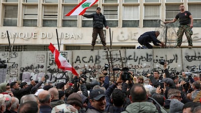 Lebanese protest against the deteriorating economic situation in front of the central bank's building in Beirut. Reuters