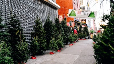 Christmas trees for sale on a sidewalk in New York, U.S. New York City had its credit rating cut by Fitch Ratings because of the impact the coronavirus pandemic is having on the city's economy. Bloomberg