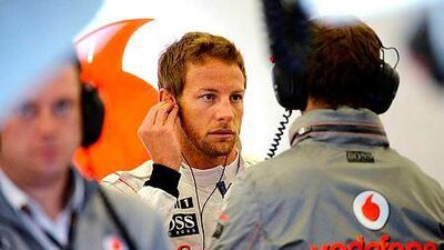 McLaren Mercedes' British driver Jenson Button, centre, was reluctant to discuss his future as he prepares for Sunday’s Japanese Grand Prix and did not know when it would be settled. AFP PHOTO / ANDREW YATES