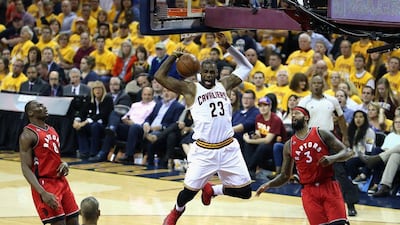 LeBron James of the Cleveland Cavaliers dunks the ball against the Toronto Raptors on Thursday night. Andy Lyons / Getty Images / AFP / May 19, 2016