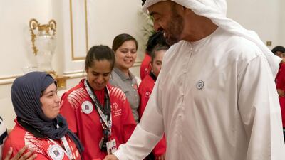 Sheikh Mohammed bin Zayed, Crown Prince of Abu Dhabi and Deputy Supreme Commander of the UAE Armed Forces (R), receives members of the UAE Special Olympics team, during a Sea Palace barza. Rashed Al Mansoori / Crown Prince Court - Abu Dhabi