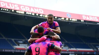Paris Saint-Germain's Argentinian forward Mauro Icardi celebrates the winner with teammates. AFP