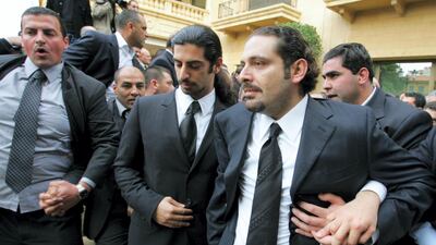 Saad Hariri and other family members leave their family home to join the funeral procession. AFP