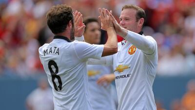 Wayne Rooney, right, of Manchester United celebrates his second goal with Juan Mata, left, during their victory over AS Roma in the International Champions Cup on Saturday. Justin Edmonds / Getty Images/ AFP