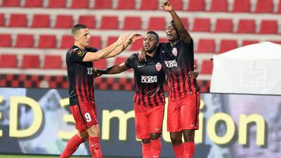 Rodrigo Lima, Ismail Al Hammadi and Asamoah Gyan of Al Ahli celebrate a goal during their win against Dibba on Saturday night. Photo Courtesy / Arshad Khan / AGL / October 22, 2016
