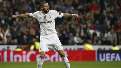 Karim Benzema celebrates completing his hat-trick with Real Madrid’s eighth goal on Tuesday night in their 8-0 win over Malmo. Juan Medina / Reuters