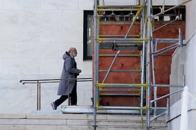 Former Fed chairman Ben Bernanke walks at the Supreme Court building in Washington. Reuters