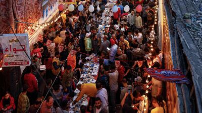 People line the street during the mass iftar event