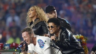 Beyoncé, Chris Martin and Bruno Mars, right, perform with guitarist Jonny Buckland at the halftime show during the NFL’s Super Bowl 50 football game between the Carolina Panthers and the Denver Broncos in Santa Clara, California. Stephen Lam / Reuters