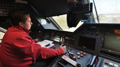 Above, train driver Willy Crooks, who drove Queen Elizabeth II and French president Francois Mitterrand between Calais and Folkestone during the tunnel's inauguration on May 6, 1994. A record 20.4 million passengers were transported between Britain and France using the tunnel in 2013. Denis Charlet / AFP