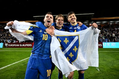 Ermedin Demirovic, Dzenis Burnic and Tarik Muharemovic of Bosnia and Herzegovina celebrate their World Cup qualification. Getty Images