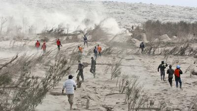 Rescuers search victims of the eruption of Mount Sinabung in Suka Meriah, North Sumatra, Indonesia, Sunday, Feb. 2, 2014. Mount Sinabung erupted Saturday killing more than a dozen of people. Binsar Bakkar / AP Photo