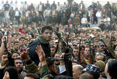 Mr Zubeidi being carried on the shoulders of supporters of Al Aqsa Martyrs Brigades at a rally in Jenin in 2004. AFP