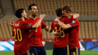 Spain's Dani Olmo celebrates scoring their first goal with Jordi Alba, Pedri and Sergio Busquets. Reuters