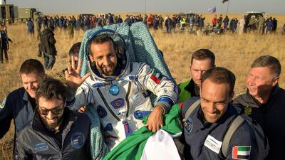 In this image released by NASA, Russian space agency rescue team members and United Arab Emirates (UAE) specialists carry UAE astronaut Hazzaa al-Mansoori shortly after the landing of the Russian Soyuz MS-12 space capsule about 150kms (90 miles) southeast of the Kazakh town of Dzhezkazgan on October 3, 2019. A three-man crew including an Emirati who became the first Arab to reach the International Space Station returned to Earth safely on Thursday and were in good shape, the Russian space agency Roscosmos said. - RESTRICTED TO EDITORIAL USE - MANDATORY CREDIT "AFP PHOTO / NASA / Bill INGALLS" - NO MARKETING NO ADVERTISING CAMPAIGNS - DISTRIBUTED AS A SERVICE TO CLIENTS / AFP / NASA / Bill INGALLS / RESTRICTED TO EDITORIAL USE - MANDATORY CREDIT "AFP PHOTO / NASA / Bill INGALLS" - NO MARKETING NO ADVERTISING CAMPAIGNS - DISTRIBUTED AS A SERVICE TO CLIENTS