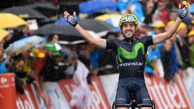 Spain’s Jon Izaguirre Insausti celebrates as he crosses the finish line at the end of the 146,5 km twentieth stage of the 103rd edition of the Tour de France cycling race on July 23, 2016 between Megeve and Morzine-Avoriaz, French Alps. / AFP / LIONEL BONAVENTURE