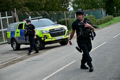 Armed police stand guard outside RAF Fairford. AFP