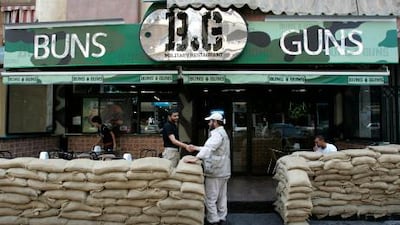 Dig in: Sandbags surround the exterior of Buns and Guns, a new fast food restaurant in the Beirut suburb of Dahiyeh. AP