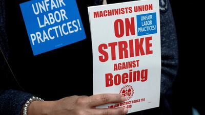 A Boeing worker at a union rally in Seattle, Washington. The strike began on September 13. Reuters