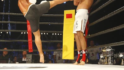 Jaideep Singh of India, right, takes evasive action as Fatih Ulusoy of Turkey put in an action-packed performance during their super heavyweight bout of the Global Fighting Championship in Dubai. Jeffrey E Biteng / The National