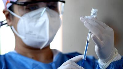 A nurse prepares a dose of the Pfizer-BioNTech vaccine against Covid-19 at the vaccination center set up at the Cabanas Institute in Guadalajara, Jalisco state, Mexico. AFP