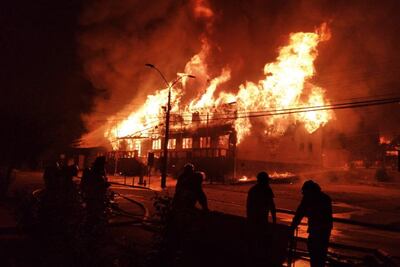 Several buildings were set ablaze in the town following the disturbance overnight. EPA.