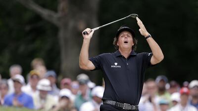 Phil Mickelson held the lead on the back nine during the final round of the US Open last year before a historical late collapse. Darron Cummings / AP Photo