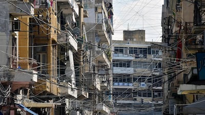 Electric wires connected to a generator which runs when the national power grid is down in one of Tripoli's heavily populated neighbourhoods, north Lebanon, 30 July 2018 EPA