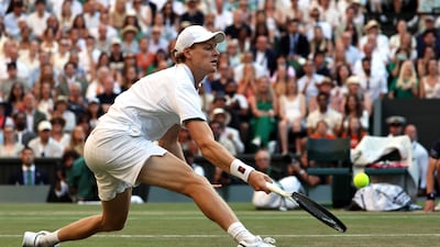 Jannik Sinner hits a return against Alexander Zverev in the Wimbledon final. EPA