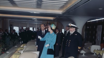 The queen is shown around the new liner by Cunard chairman Sir Basil Smallpeice, left, May 1969. On the right is Commodore William Warwick, the liner's first master. Getty Images