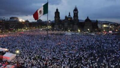 Thousands hold up lit candles at the main Zocalo square in Mexico City during a protest against the tide of killings, kidnappings and shootouts sweeping the country.