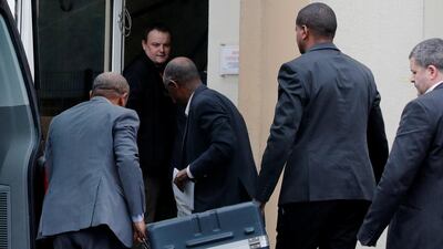 Men unload a case containing the black boxes from the crashed Ethiopian Airlines Boeing 737 MAX 8 outside the headquarters of France's BEA air accident investigation agency in Le Bourget, north of Paris, France. Reuters