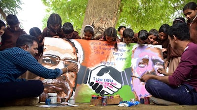 Artists give final touches of a painting depicting US President Donald Trump and India's Prime Minister Narendra Modi in Bikaner, ahead of US President Donald Trump first official visit to India. AFP