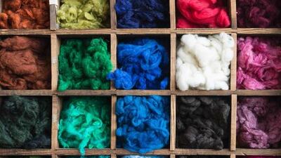 Dyed wool produced by Abraham Moon & Sons are supplied to customers such as Burberry, Paul Smith and Ralph Lauren. Oli Scarff / AFP