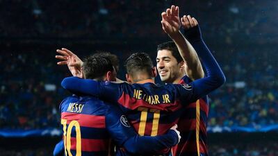 Barcelona's Lionel Messi, Neymar and Luis Suarez celebrate a goal against Arsenal on Wednesday night in their Champions League victory. Pau Barrena / AFP / March 16, 2016